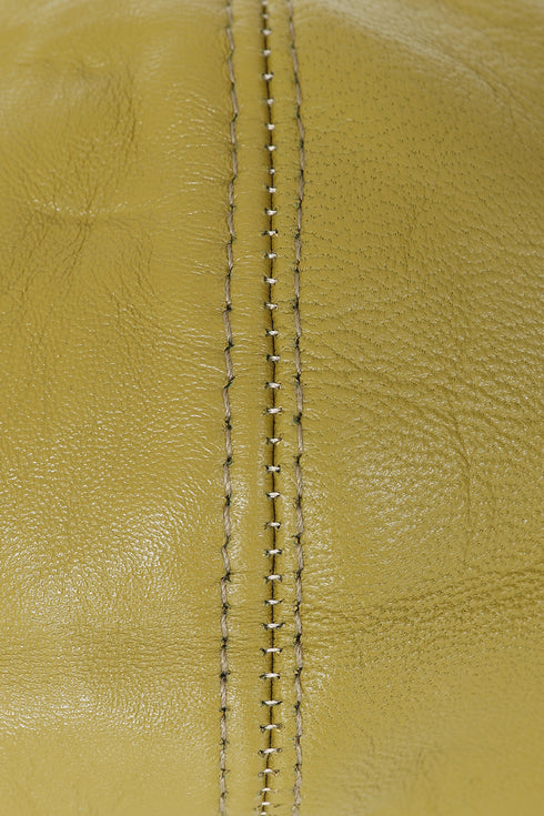 Olive lamb nappa leather flat cap in London style by LLD Original, showcasing a sleek, casual design.