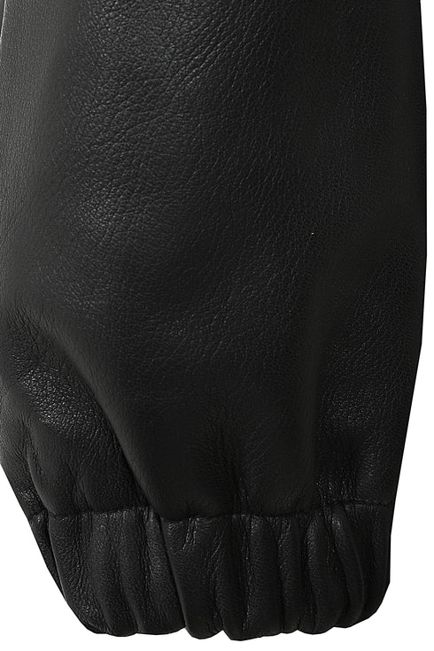 Women's ¾ length black leather duffle coat with detachable fur hood from LLD Original, featuring a drawstring detail.
