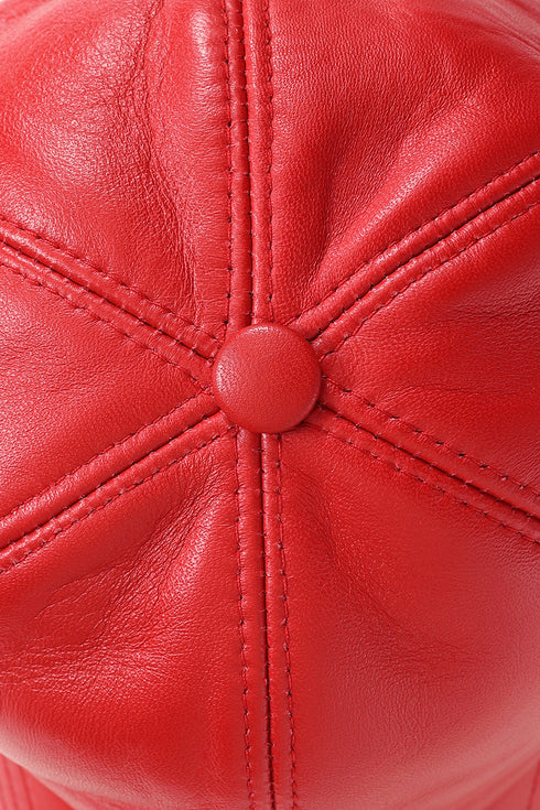 Red curved peak baseball cap made from nappa leather by LLD Original, featuring an adjustable strap.